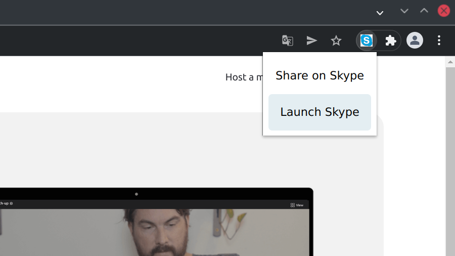 Screenshot of a browser window with Skype extension icon. The extension pop-up is open displaying two menu items: Share on Skype and Launch Skype